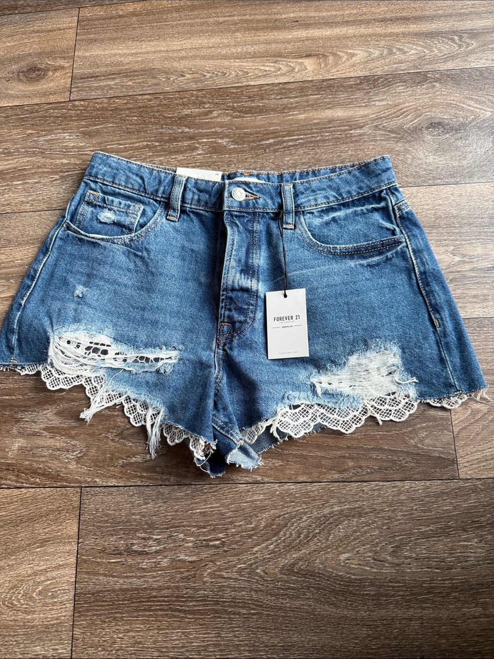 Forever 21 Blue Denim Distressed Shorts with White Lace Trim